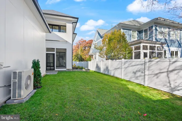 a front view of house with yard and outdoor seating