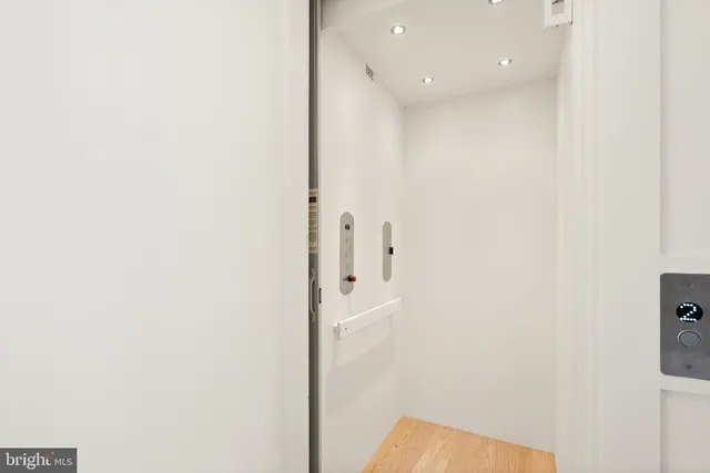 a view of a hallway with white walls