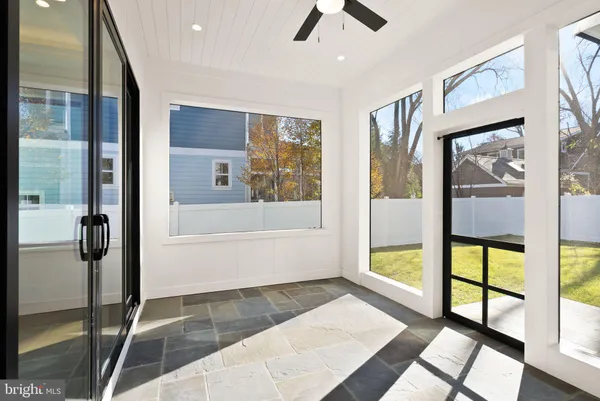 a hallway with granite countertop a stove and a sink