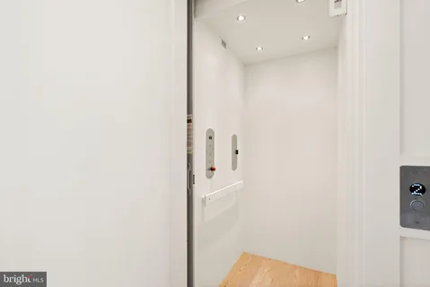 a view of a room with window and a ceiling fan