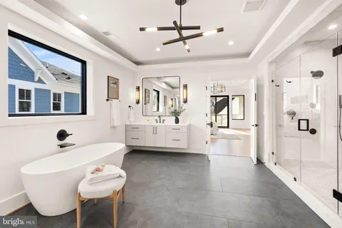 a view of a house with a yard and pathway