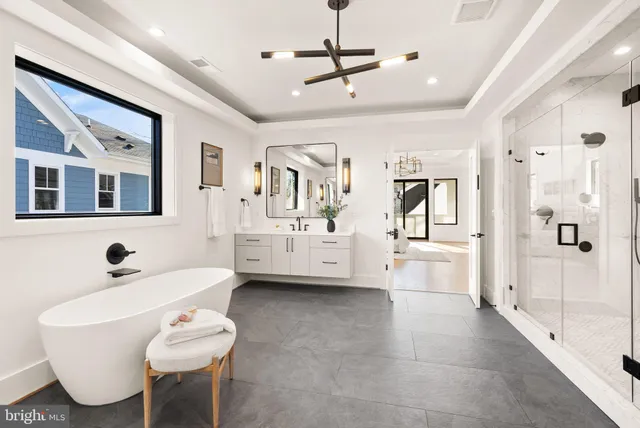 a view of a house with a yard and pathway