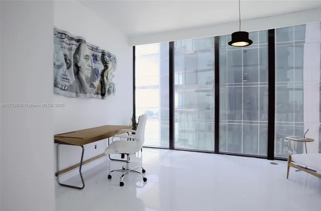 a bedroom with furniture and window