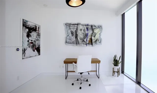 a view of a livingroom with a workspace