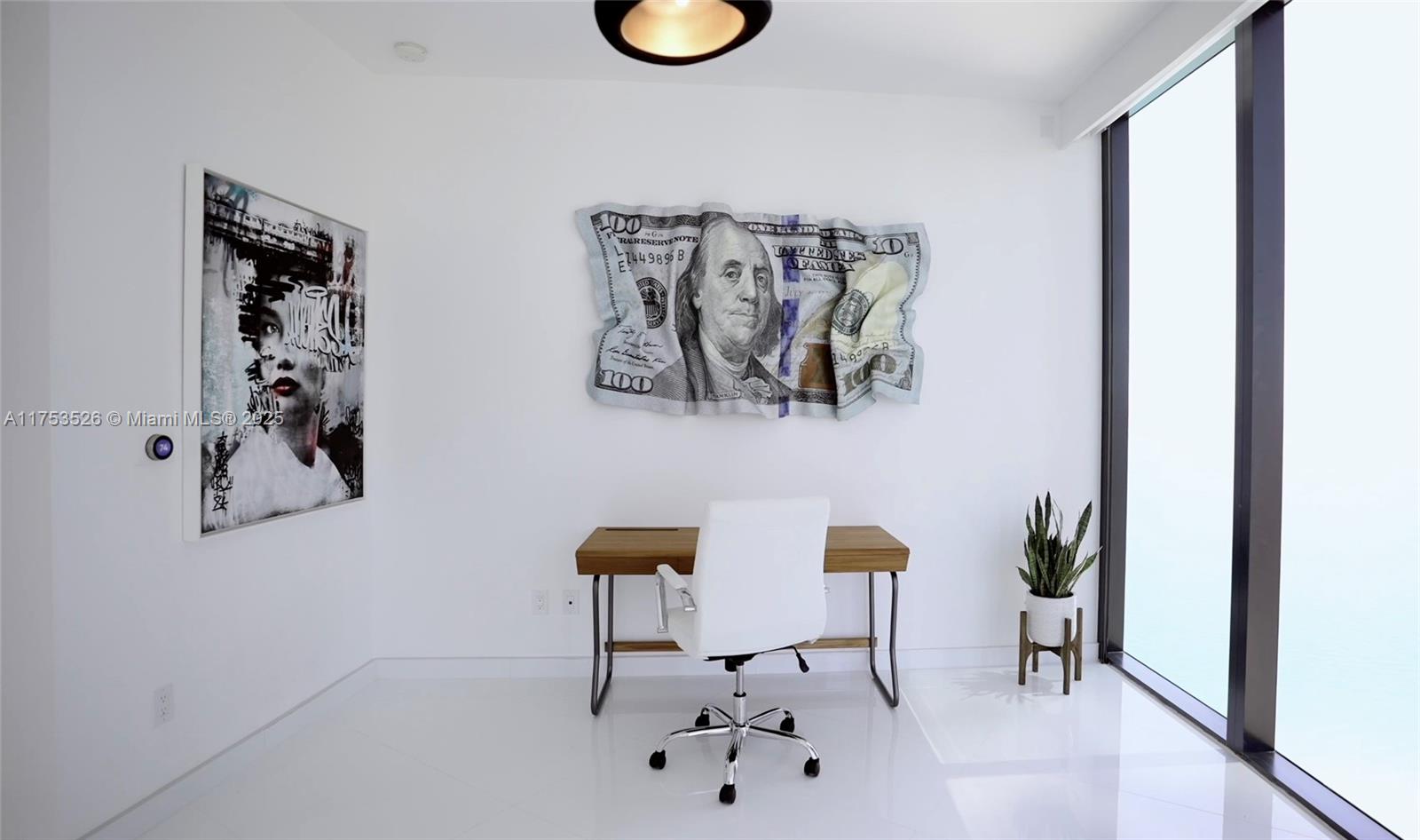 18555 Collins Avenue, Unit 3601 Sunny Isles Beach, FL 33160 - Photo 13 of 16 a living room with furniture and a wooden floor