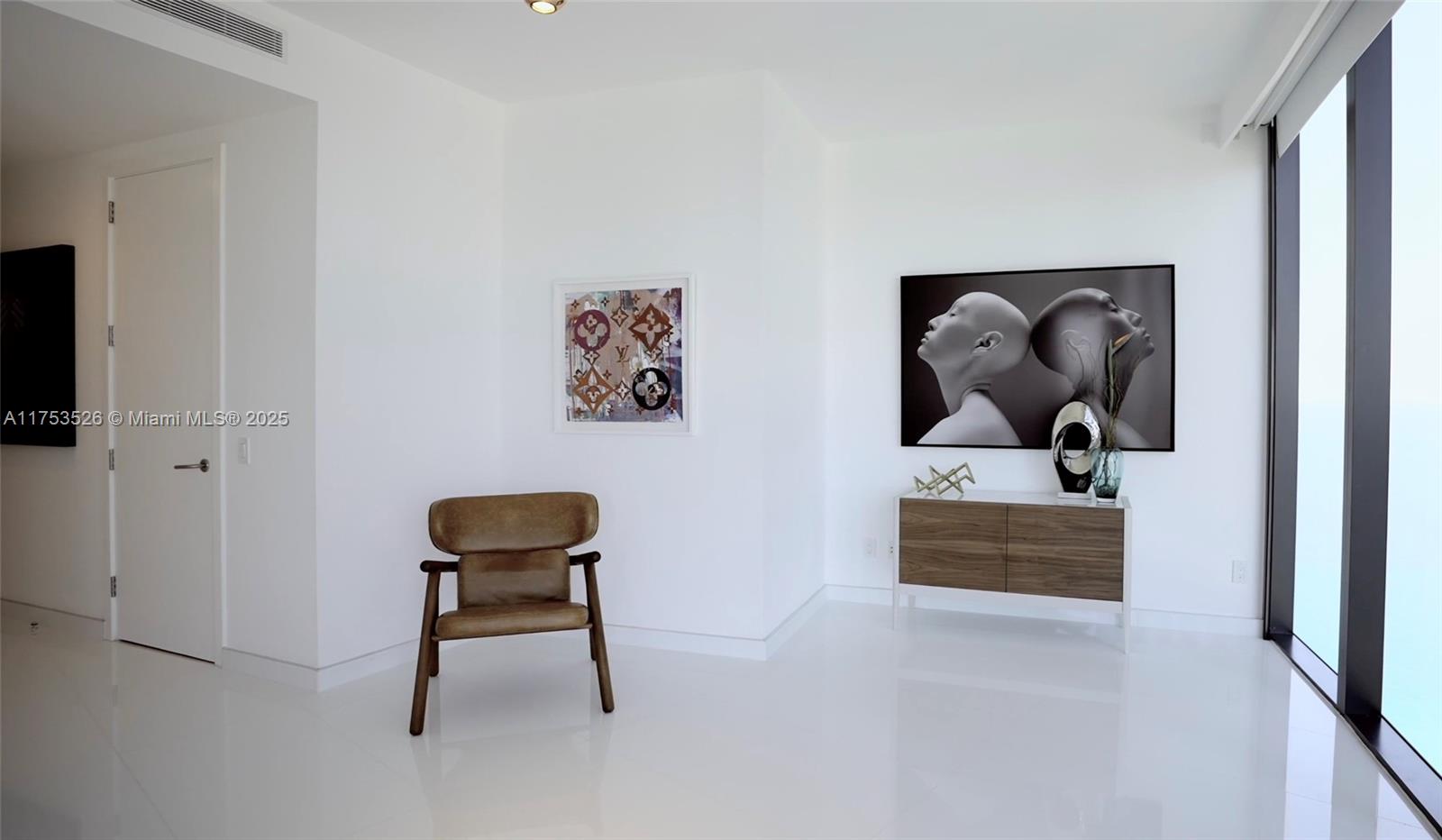 18555 Collins Avenue, Unit 3601 Sunny Isles Beach, FL 33160 - Photo 15 of 16 a view of a livingroom with a workspace