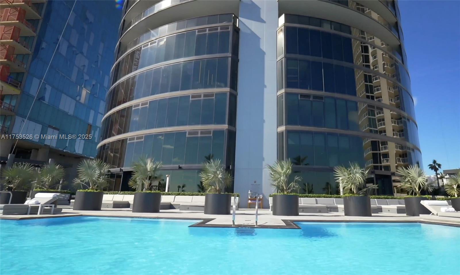 18555 Collins Avenue, Unit 3601 Sunny Isles Beach, FL 33160 - Photo 16 of 16 a view of a building with garden