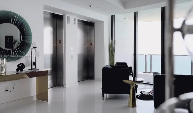 a bedroom with a bed and a view of kitchen