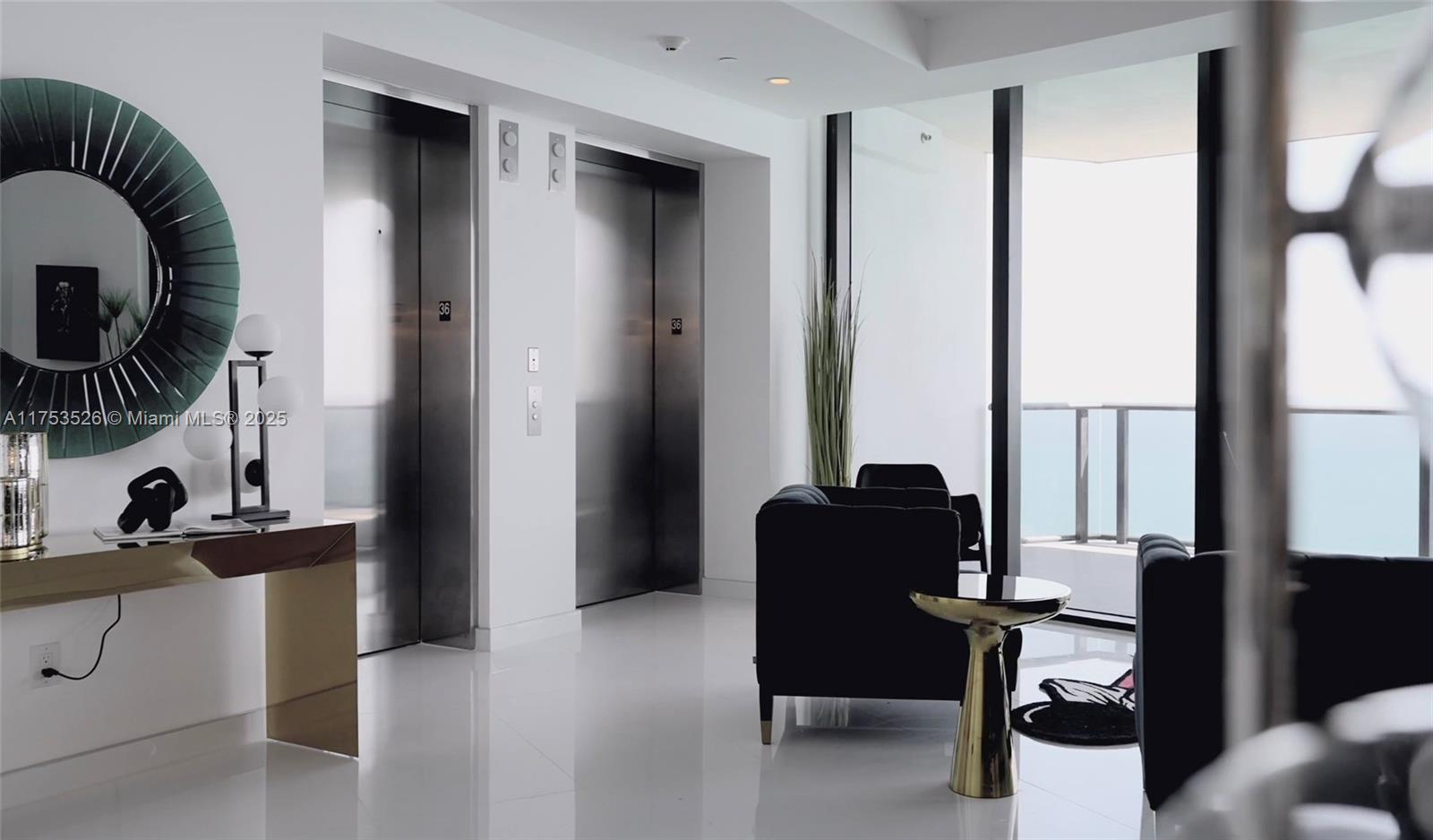 18555 Collins Avenue, Unit 3601 Sunny Isles Beach, FL 33160 - Photo 4 of 16 a view of a workspace with furniture and a window