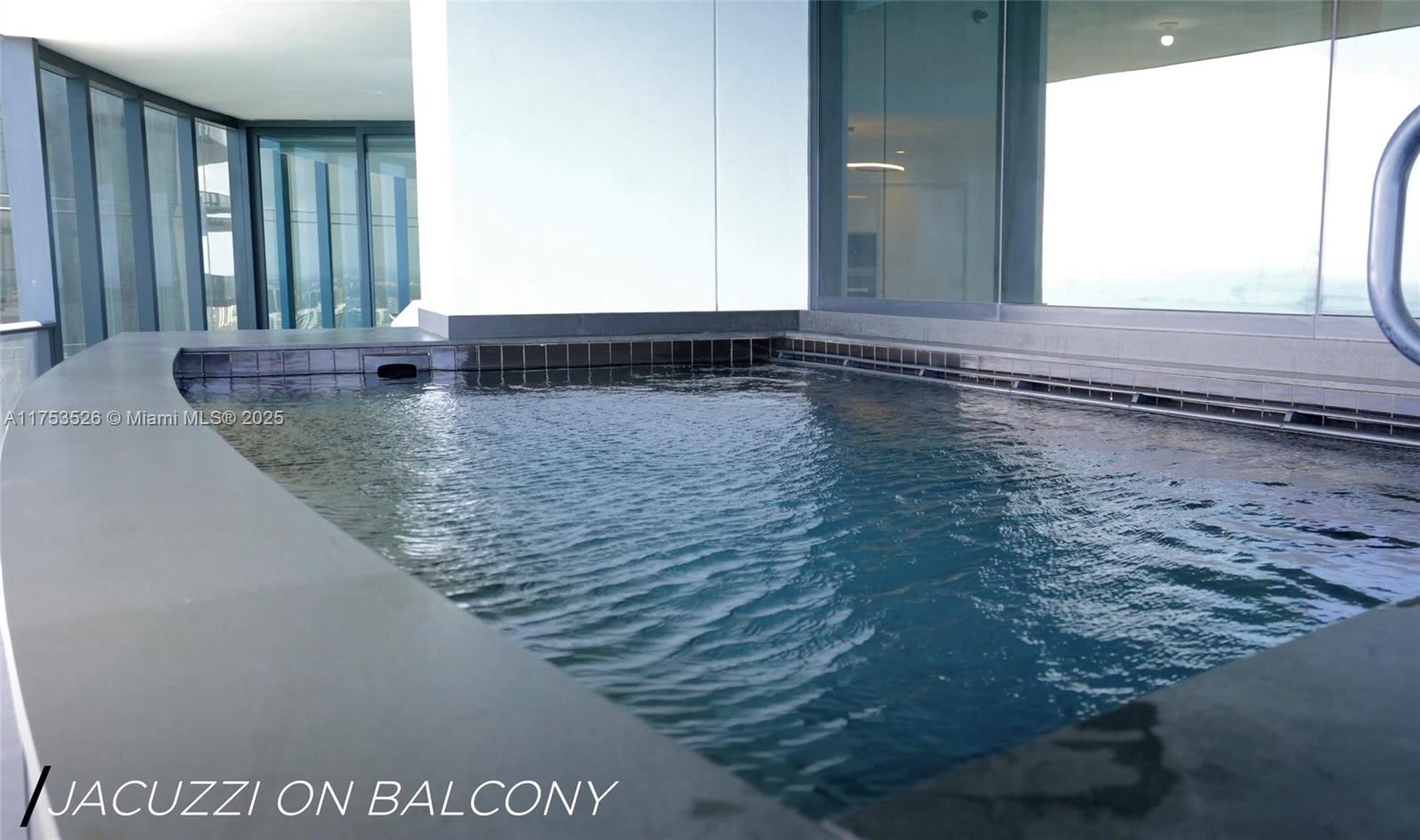 18555 Collins Avenue, Unit 3601 Sunny Isles Beach, FL 33160 - Photo 10 of 16 a view of a bathroom with sink and window