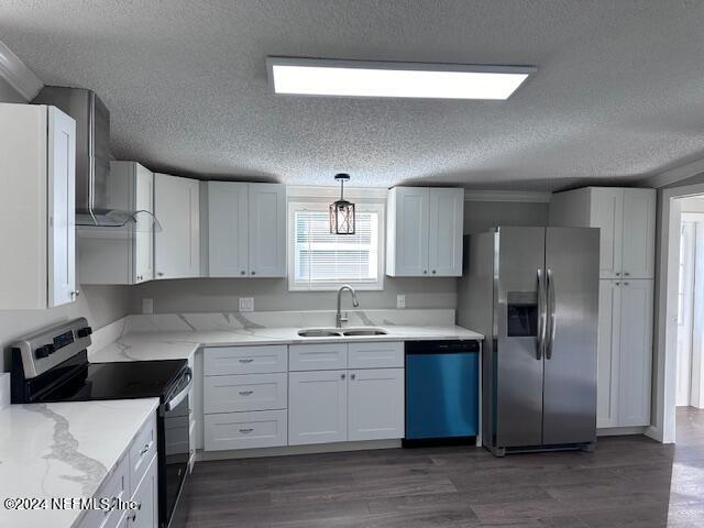 4987 Hemlock Road Macclenny, FL 32063 - Photo 3 of 17 a kitchen with a sink a refrigerator and cabinets