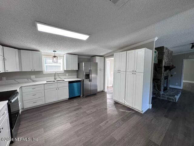 4987 Hemlock Road Macclenny, FL 32063 - Photo 4 of 17 a large kitchen with a white stove top oven and refrigerator