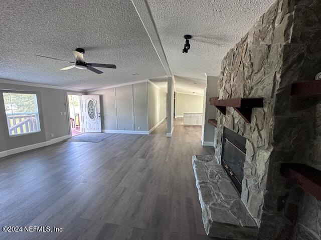 4987 Hemlock Road Macclenny, FL 32063 - Photo 7 of 17 a view of an empty room with wooden floor and a fireplace
