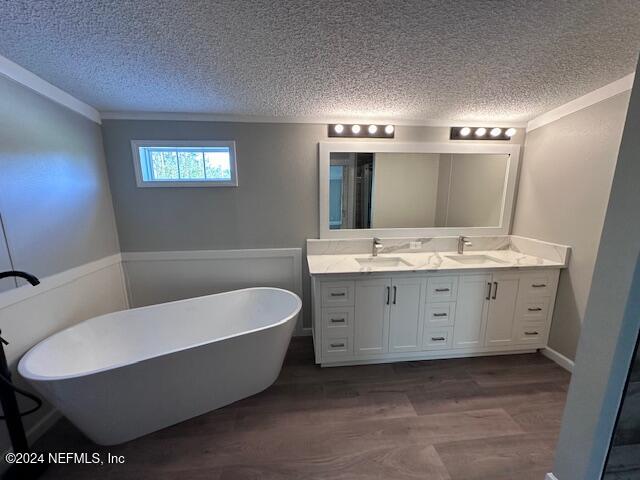 4987 Hemlock Road Macclenny, FL 32063 - Photo 10 of 17 a bathroom with a tub sink and mirror