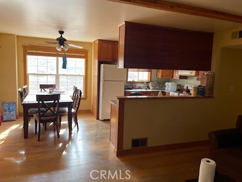 13918 Spring Valley Road Caliente, CA 93518 - Photo 1 of 1 a dining room with furniture a floor to ceiling window and wooden floor