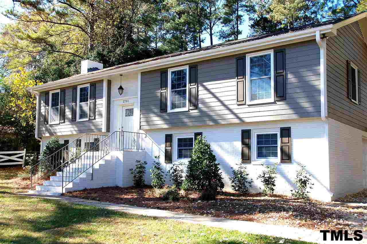 2701 Wycliff Road Raleigh, NC 27607 - Photo 1 of 16 Exterior of home has new hardiplank, new fresh paint palette, new shutters, front door and lighting.