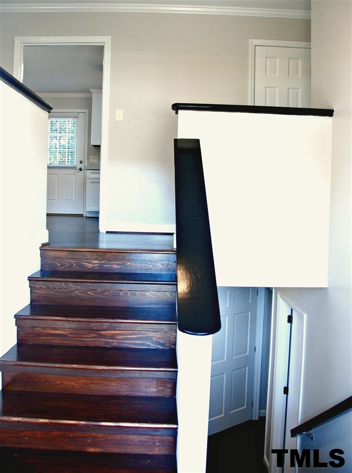 2701 Wycliff Road Raleigh, NC 27607 - Photo 12 of 16 Split entry with wooden stairs.