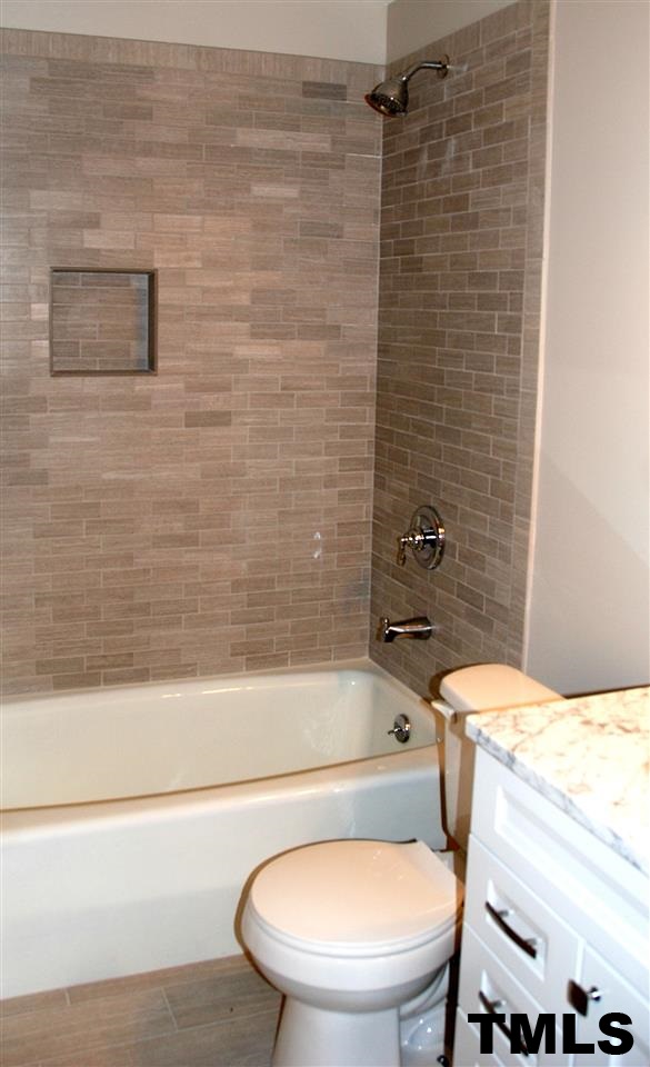2701 Wycliff Road Raleigh, NC 27607 - Photo 13 of 16 Lower level full bath has new tile and granite.