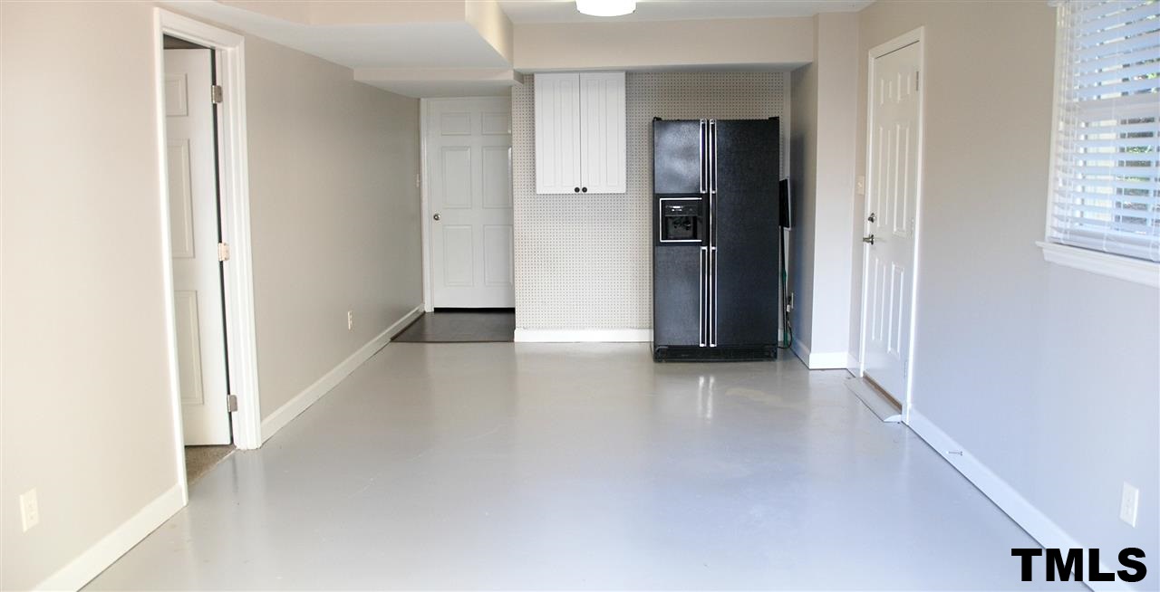2701 Wycliff Road Raleigh, NC 27607 - Photo 14 of 16 Extra large storage area/Hobby Room/Work ship heated and cooled. Laundary room. Epoxy floor. Refrigerator.