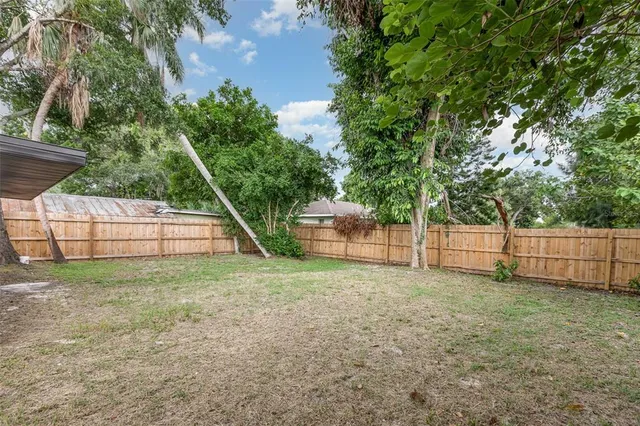 a view of a backyard with a small cabin