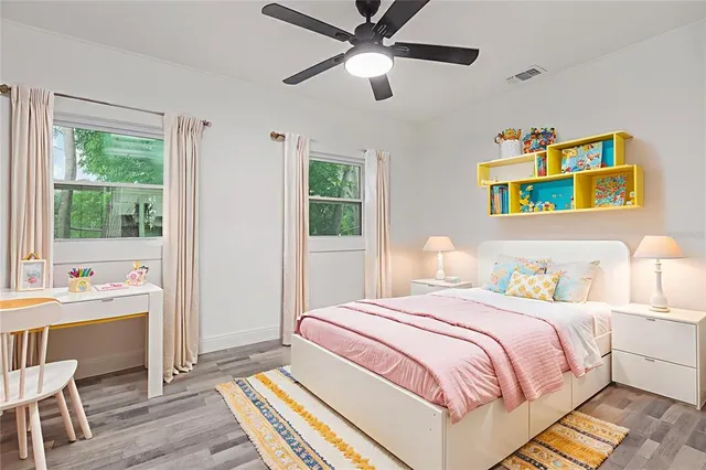 a bedroom with a bed and a table