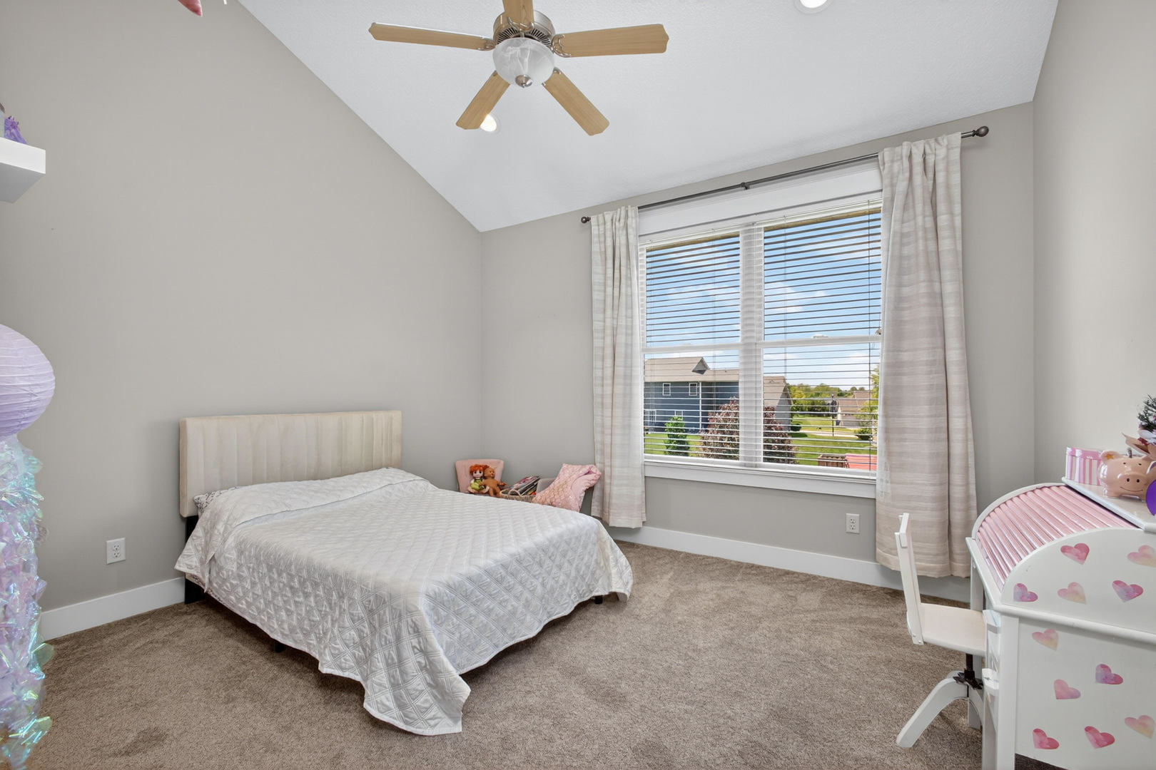 5700 Emily Road Bettendorf, IA 52722 - Photo 29 of 58 a bedroom with a bed and a window