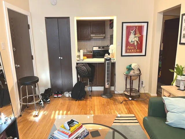 a room with table chairs and glass door