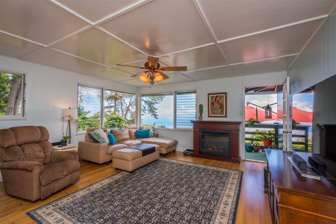 1280 Middle Road Kula, HI 96790 - Photo 7 of 28 a living room with fireplace furniture and a flat screen tv