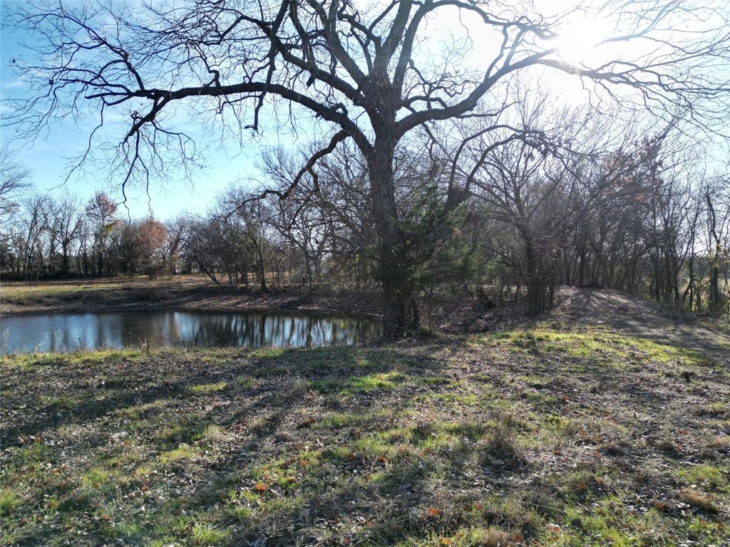Lot 5-tbd Lot 5-tbd Hidden Valley Rd Valley View Valley View, TX 76272 - Photo 4 of 25 a view of a lake with a house in the background