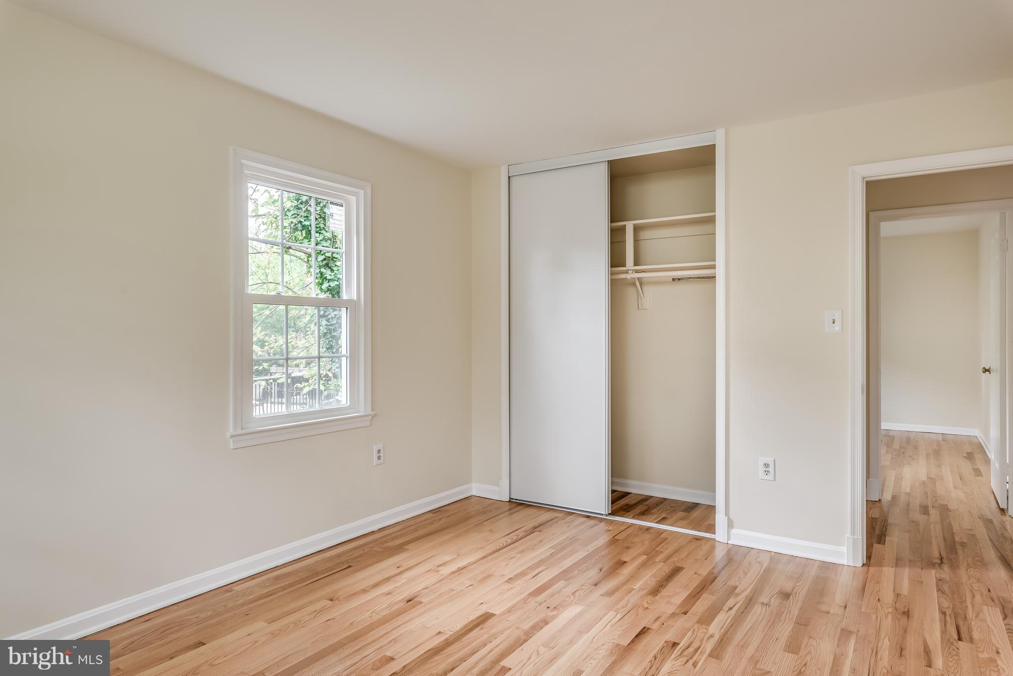 1709 Birch Road McLean, VA 22101 - Photo 22 of 30 a view of an empty room with wooden floor and a window