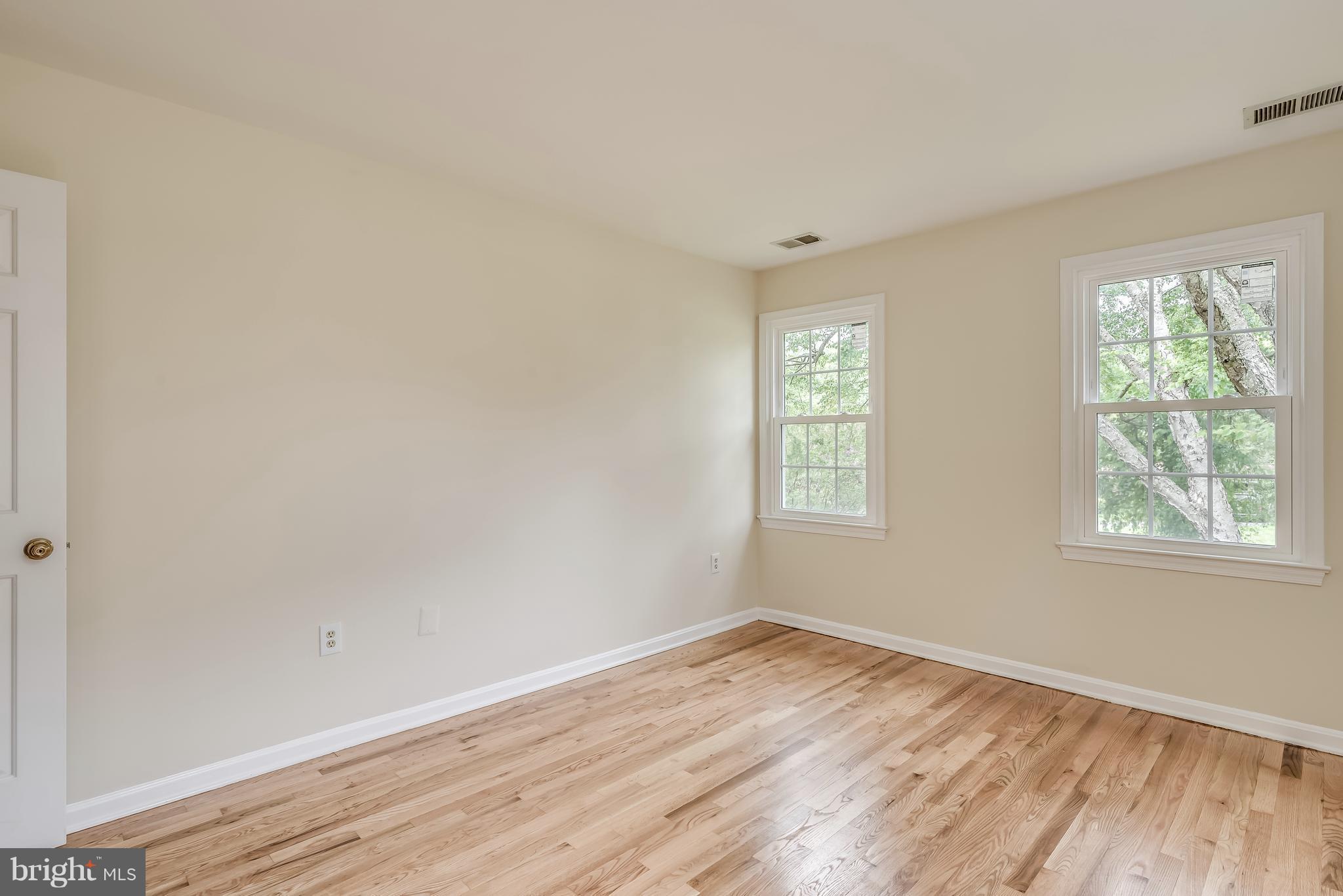 1709 Birch Road McLean, VA 22101 - Photo 25 of 30 an empty room with wooden floor and windows