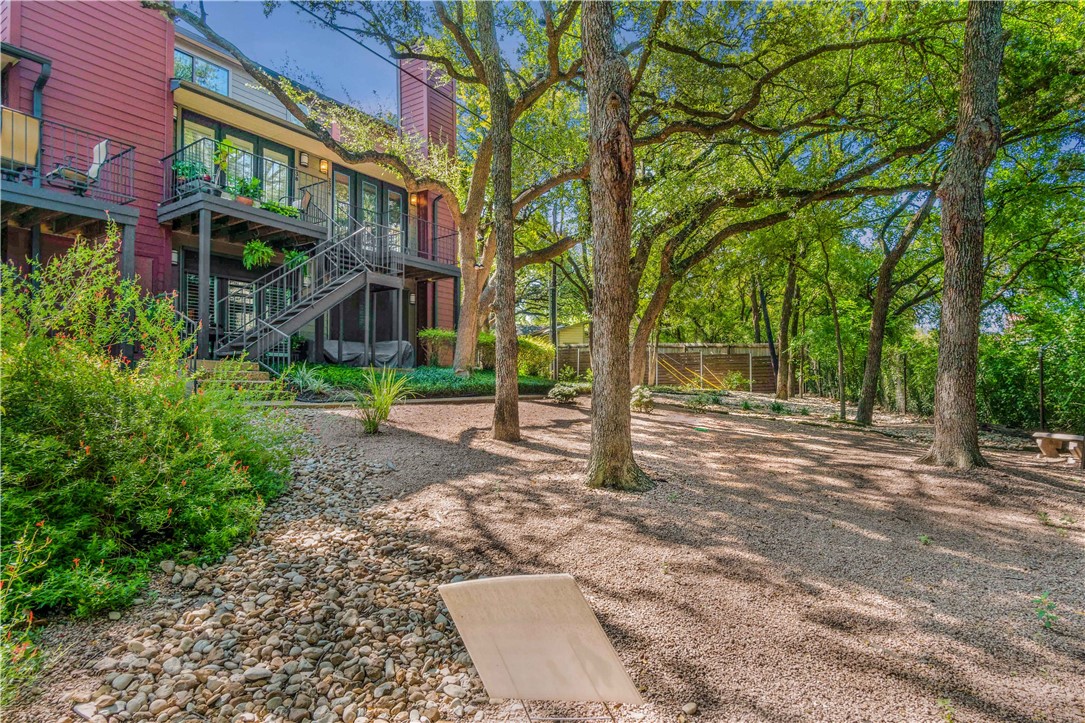 1501 Barton Springs Road, Unit 237 Austin, TX 78704 - Photo 1 of 1 a view of a yard in front of a brick house