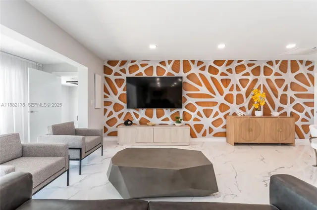 a living room with a couch and a flat screen tv