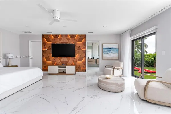 a bedroom with a bed and a view of bathroom