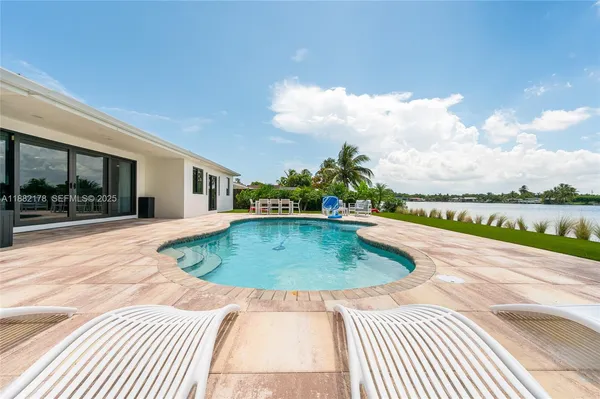 a view of outdoor space swimming pool and patio
