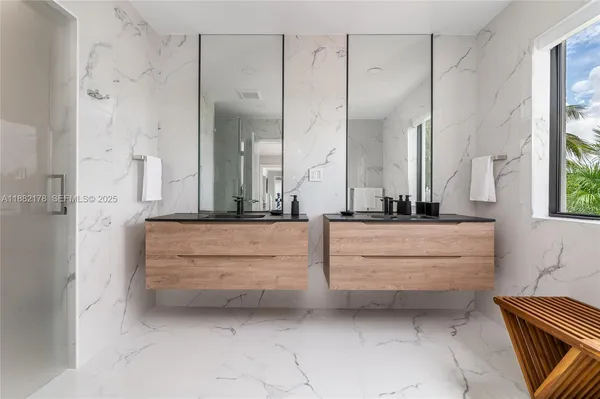 a bedroom with a bed lamp and window