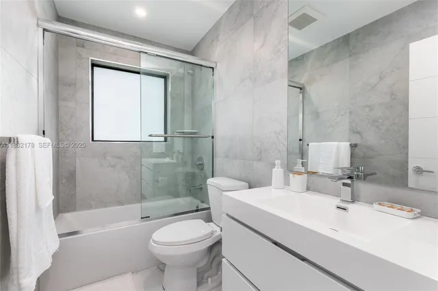 a view of swimming pool with outdoor seating and plants