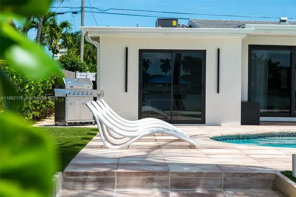 a view of house that has a patio