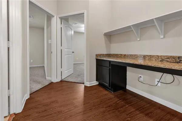 a view of cabinets and wooden floor