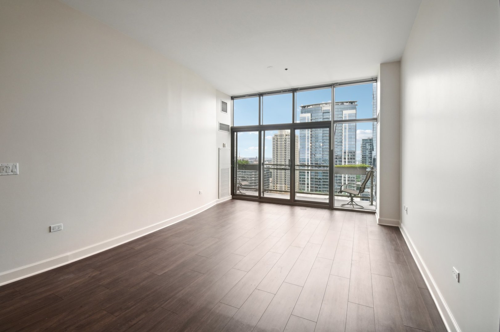 1335 South Prairie Avenue, Unit 2009 Chicago, IL 60605 - Photo 3 of 30 wooden floor in an empty room with a window