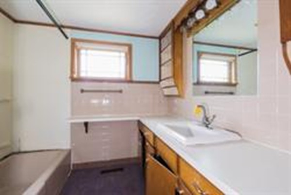 332 Williamsburg Road Conway, MA 01096 - Photo 2 of 10 a bathroom with a sink a bathtub and a window
