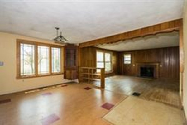 332 Williamsburg Road Conway, MA 01096 - Photo 9 of 10 a view of empty room with wooden floor and fan