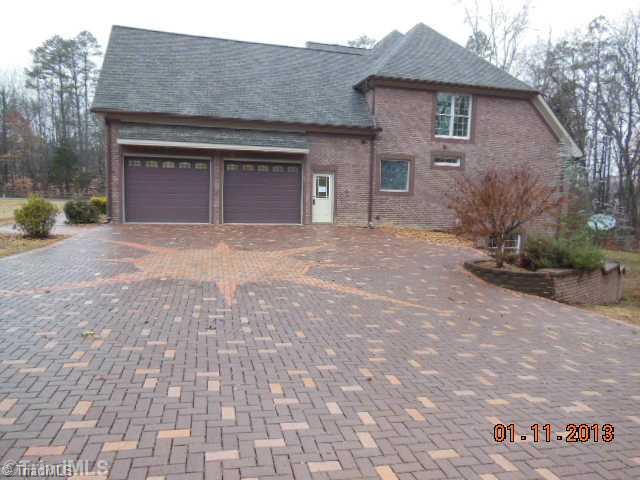 497 Griffith Road Advance, NC 27006 - Photo 15 of 16 Parking Lot/Garage. Brick driveway has a in-layed compass pattern