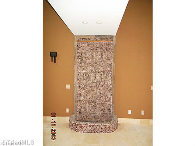 497 Griffith Road Advance, NC 27006 - Photo 4 of 16 Entry. Foyer features a ceiling to floor wall fountain