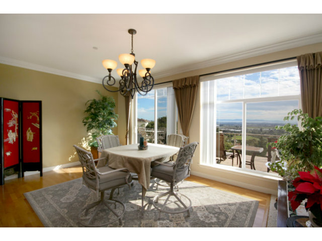 960 Smith Road Watsonville, CA 95076 - Photo 11 of 25 a dining room with furniture a chandelier and window