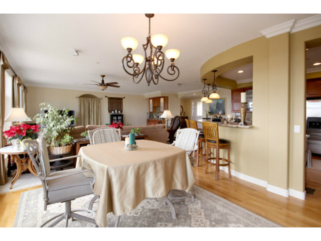 960 Smith Road Watsonville, CA 95076 - Photo 12 of 25 a view of a dining room and livingroom with furniture wooden floor a chandelier