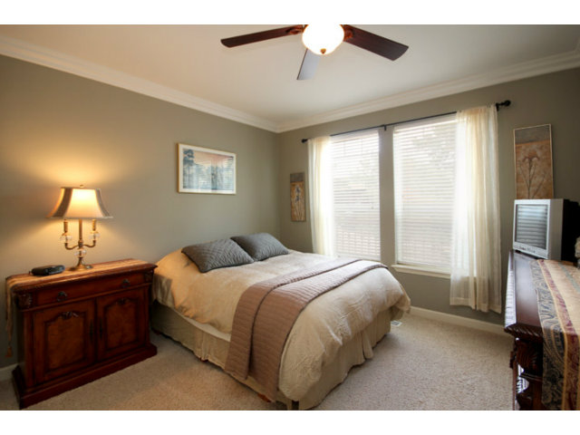 960 Smith Road Watsonville, CA 95076 - Photo 17 of 25 a bedroom with a bed and a tv on the dresser