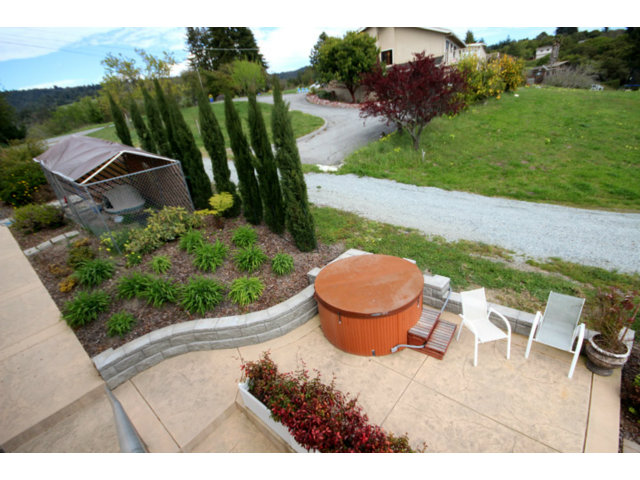960 Smith Road Watsonville, CA 95076 - Photo 21 of 25 a view of a backyard with plants and a fire pit