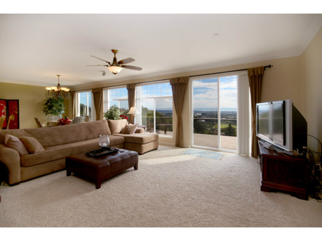 960 Smith Road Watsonville, CA 95076 - Photo 8 of 25 a living room with furniture ceiling fan and a flat screen tv