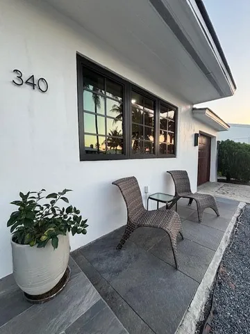 a view of a dining room with furniture and window